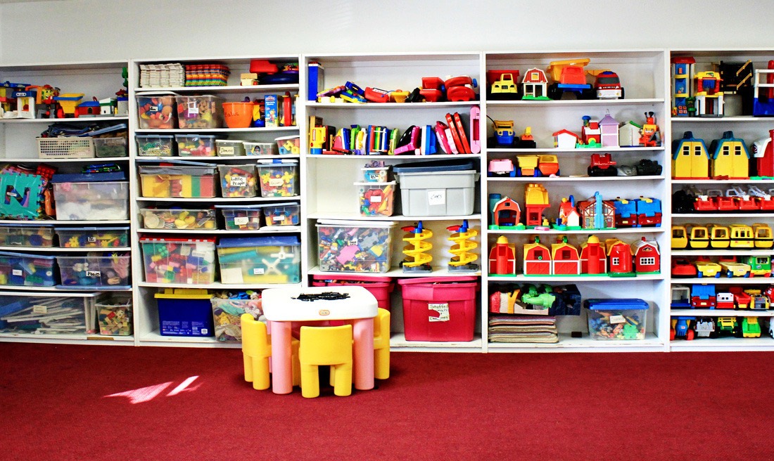 Classroom shelves filled with colorful toys and building materials